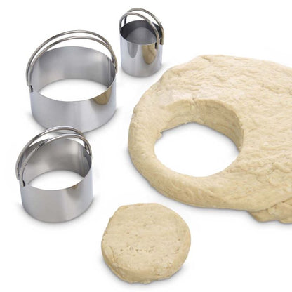 3 sizes of cutters with biscuit dough