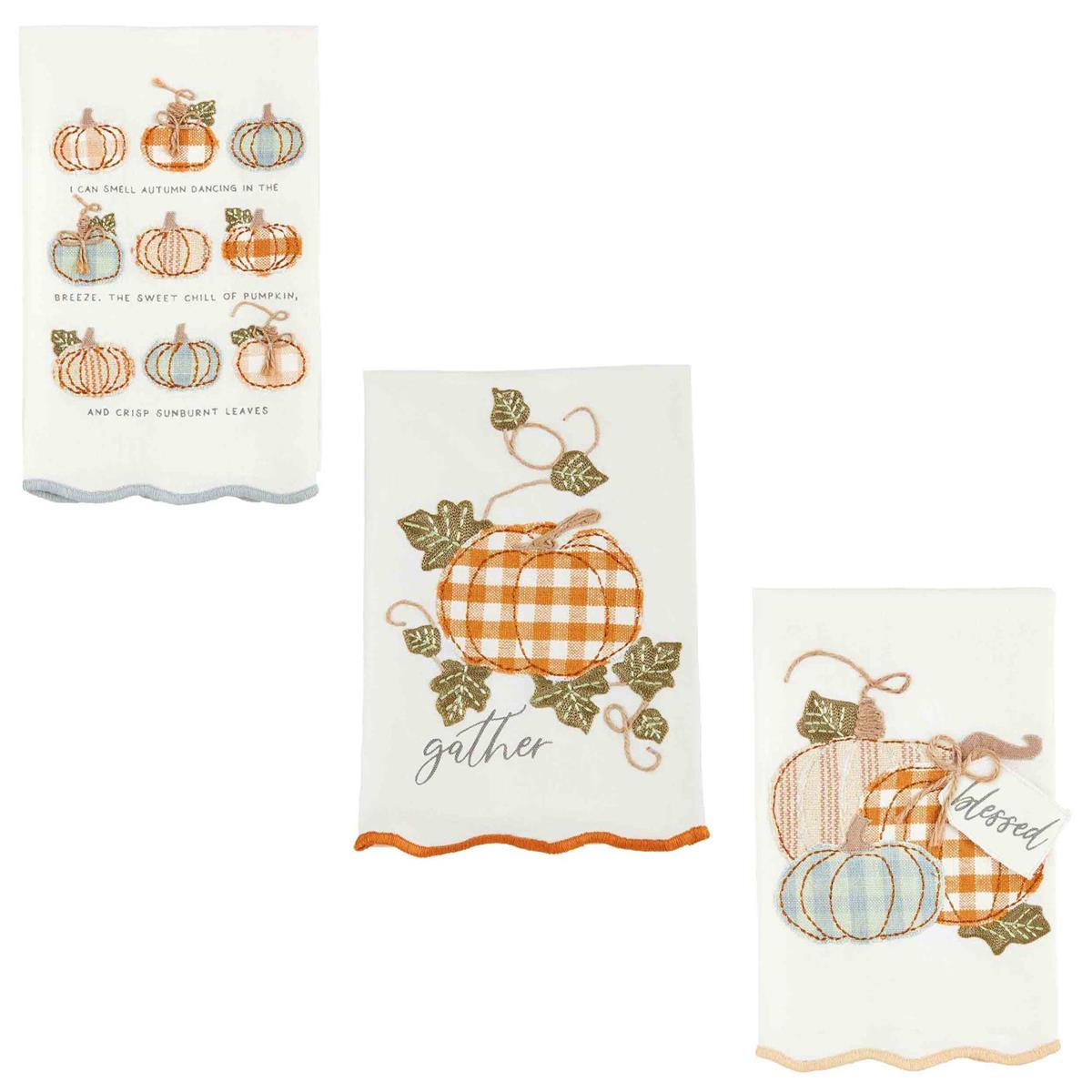 3 styles of appliqued fall towels on a white background.