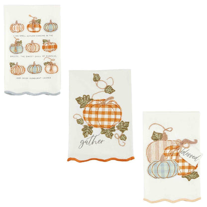 3 styles of appliqued fall towels on a white background.