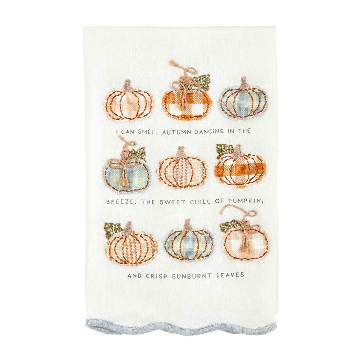 white towel with 9 small pumpkins and "i can smell autumn dancing in the breeze, the sweet chill of pumpkin, and crisp sunburnt leaves" embroidered on it.