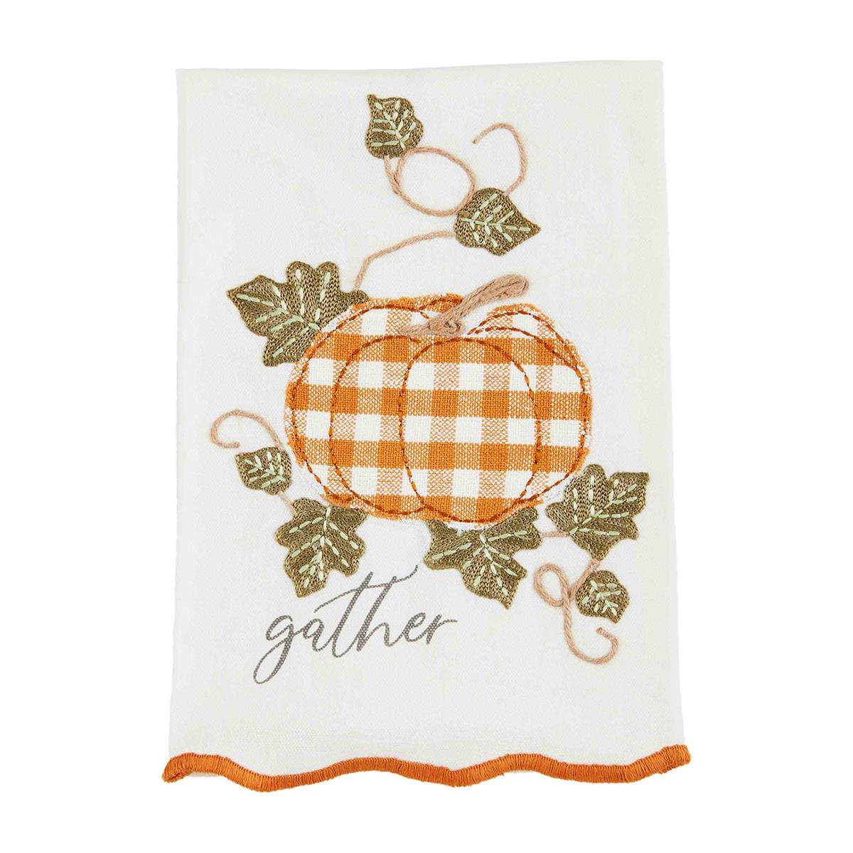 white towel with pumpkin and vines and "gather" embroidered on it.