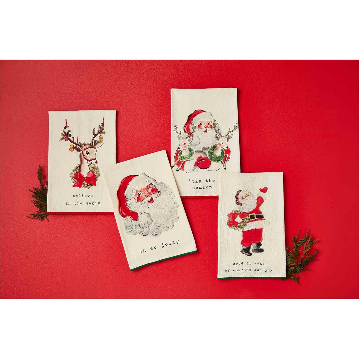 all four styles of vintage santa and reindeer mini pom towels displayed against a red background next to small pine sprigs