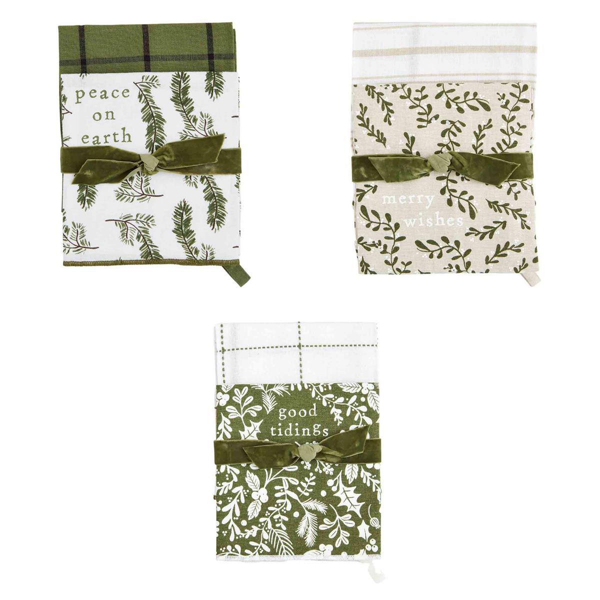 all three styles of white and green christmas towel sets displayed against a white background