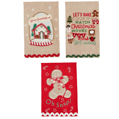 Three styles of holiday towels arranged on a white background.