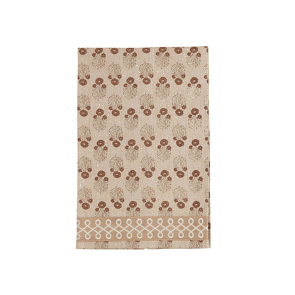 Beige towel with brown floral pattern on a white background