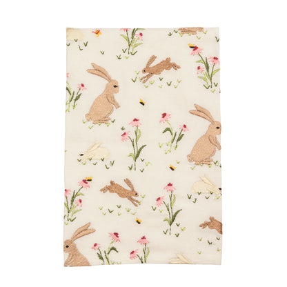 cream towel with floral and bunny pattern on it