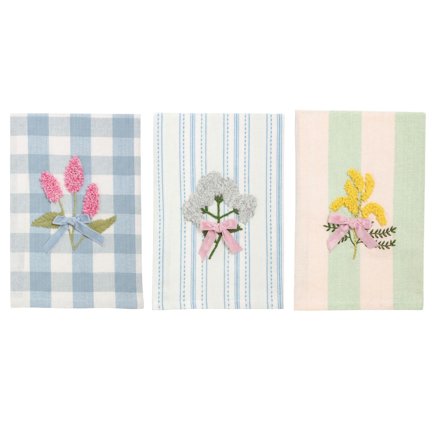 Three decorative towels with floral designs on a white background