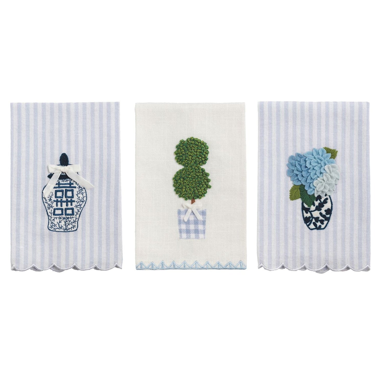 3 decorative towels with floral and topiary designs on a white background