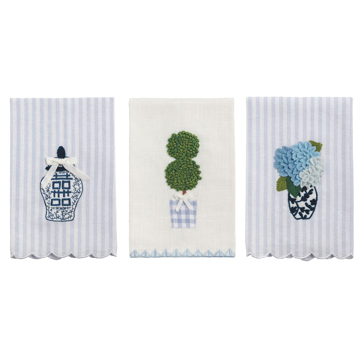 3 decorative towels with floral and topiary designs on a white background