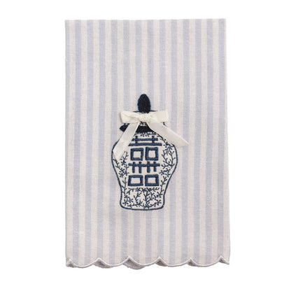 Decorative tea towel with a blue and white striped pattern and an embroidered ginger jar design.