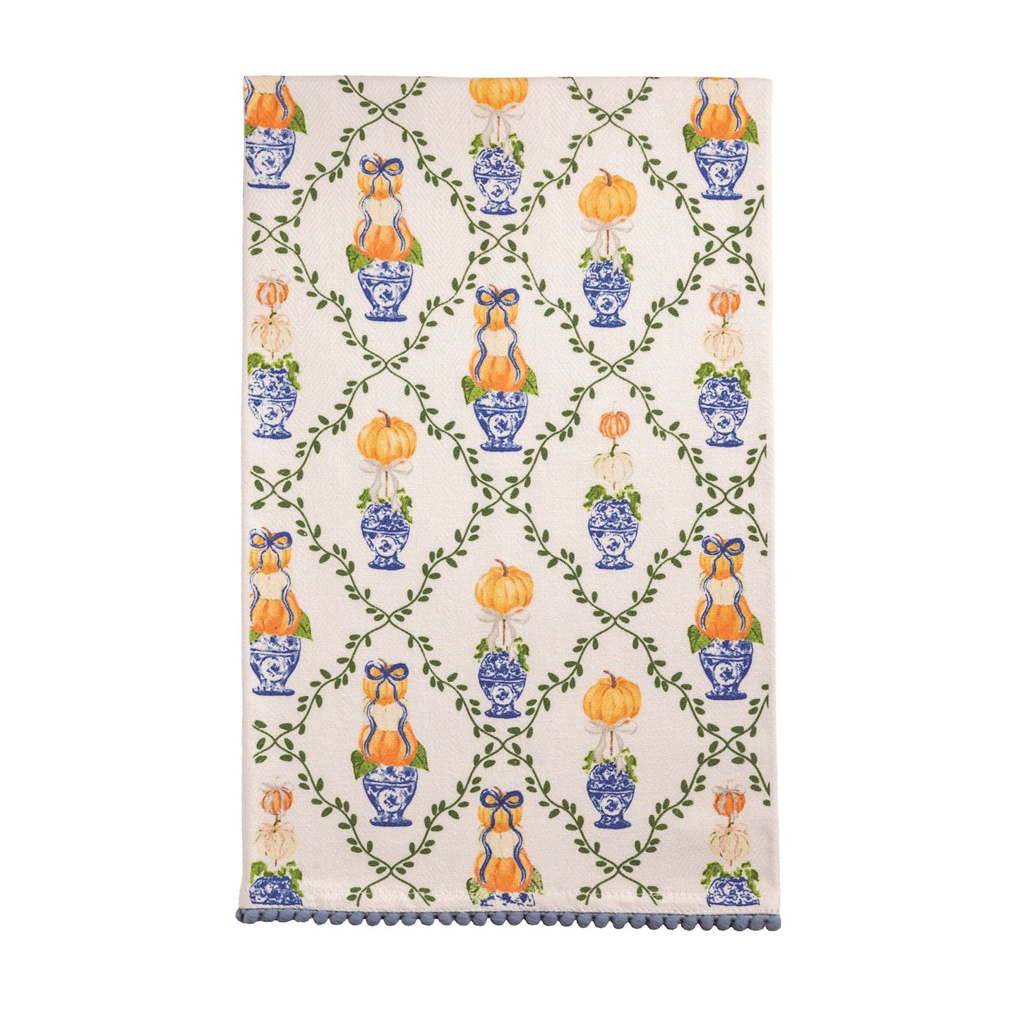 Pattern Topiary Towel with design of a vining lattice and pumpkin topiaries in blue and orange and a mini pom hem