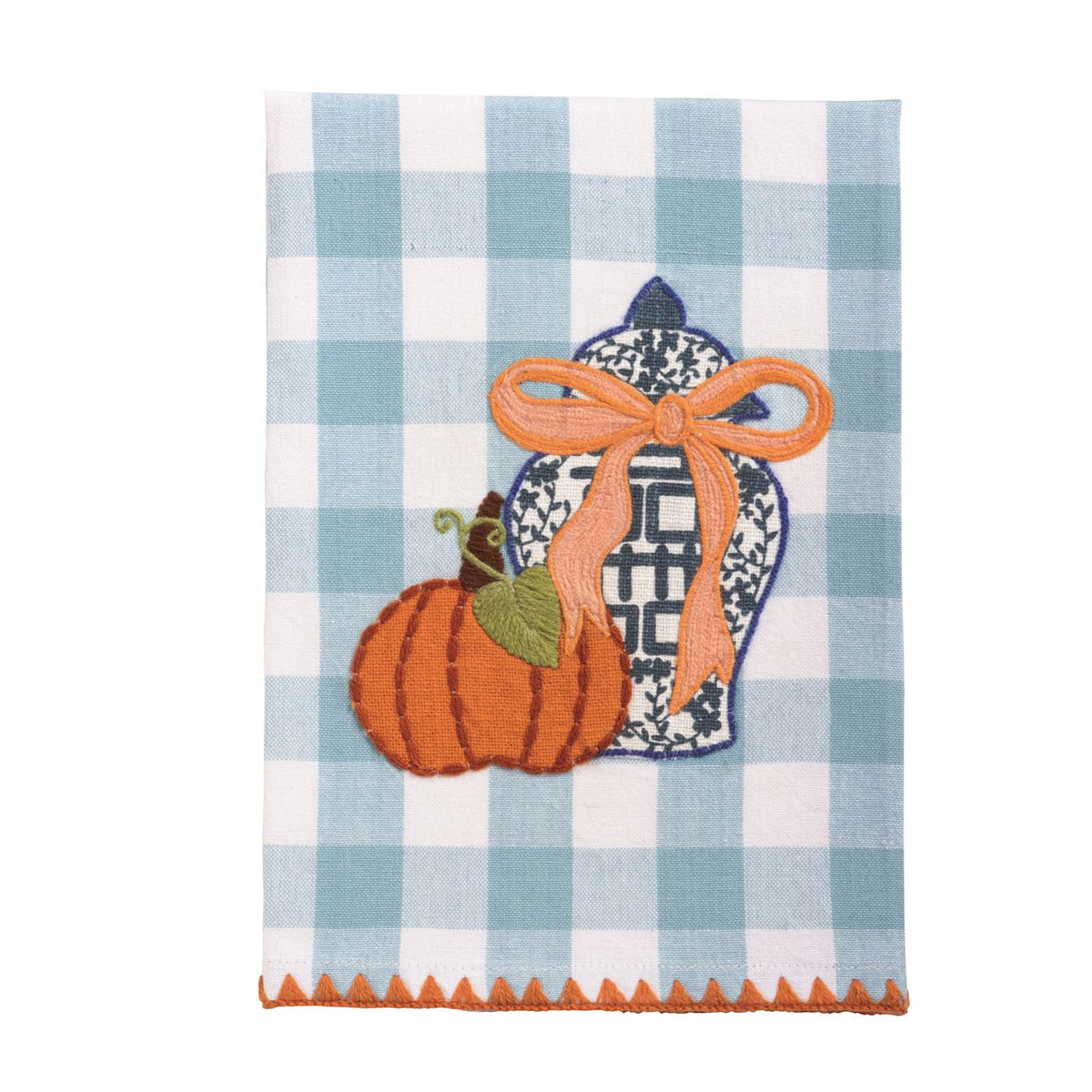 Decorative towel with embroidered design of a pumpkin, jar, and ribbon on a blue and white checkered background.