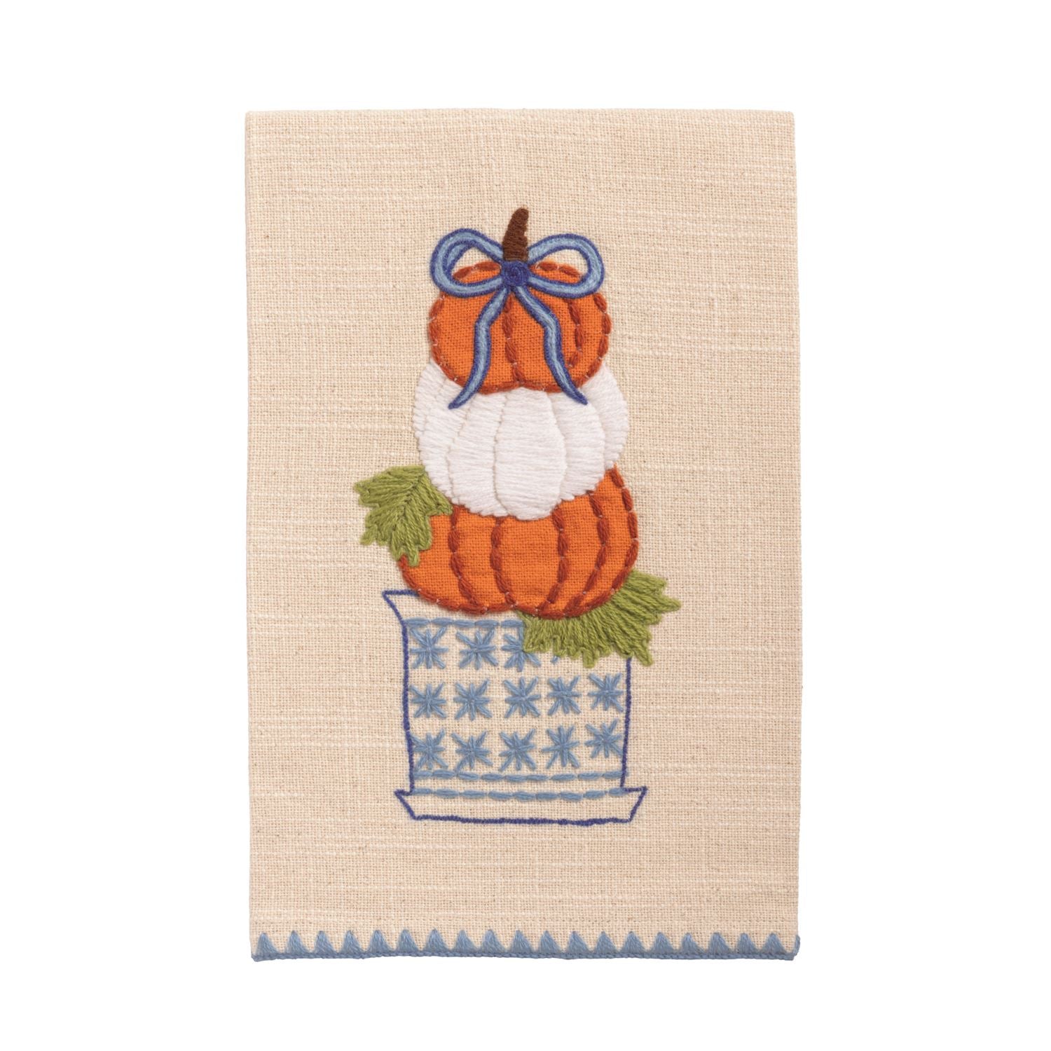 Decorative towel with embroidered pumpkin stack and a bow on a beige background