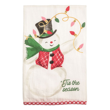 Whimsy Christmas Towel printed with playful image of a  snowman holding christmas lights and 'tis the season across the bottom