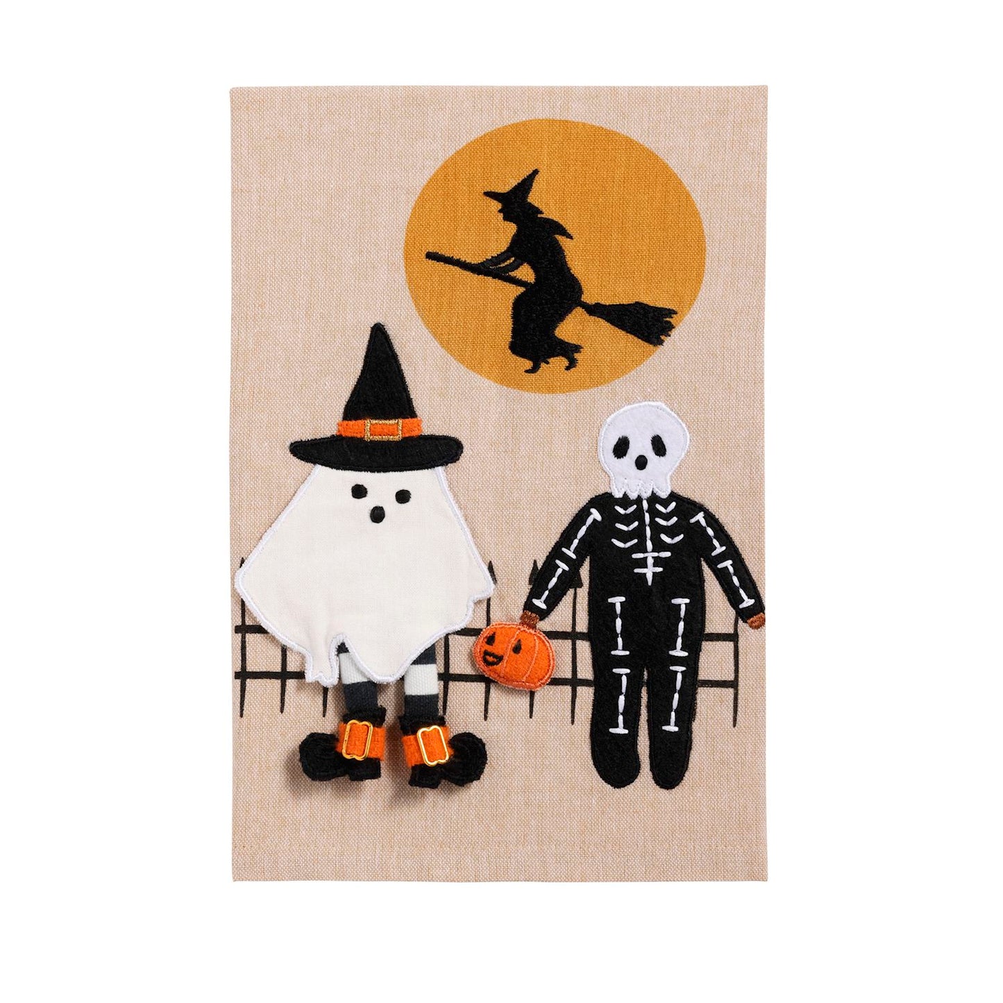 Halloween-themed tea towel with ghost, skeleton, and witch design on a beige background.