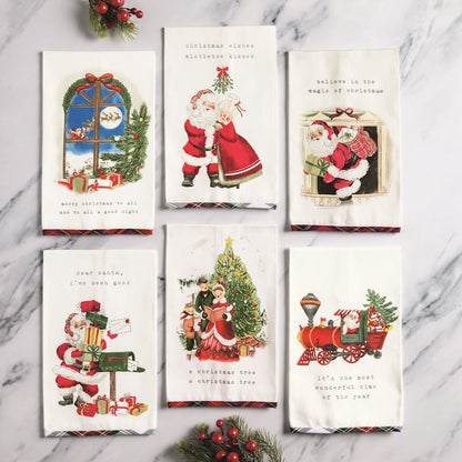 6 assorted holiday scene towels on a marble surface