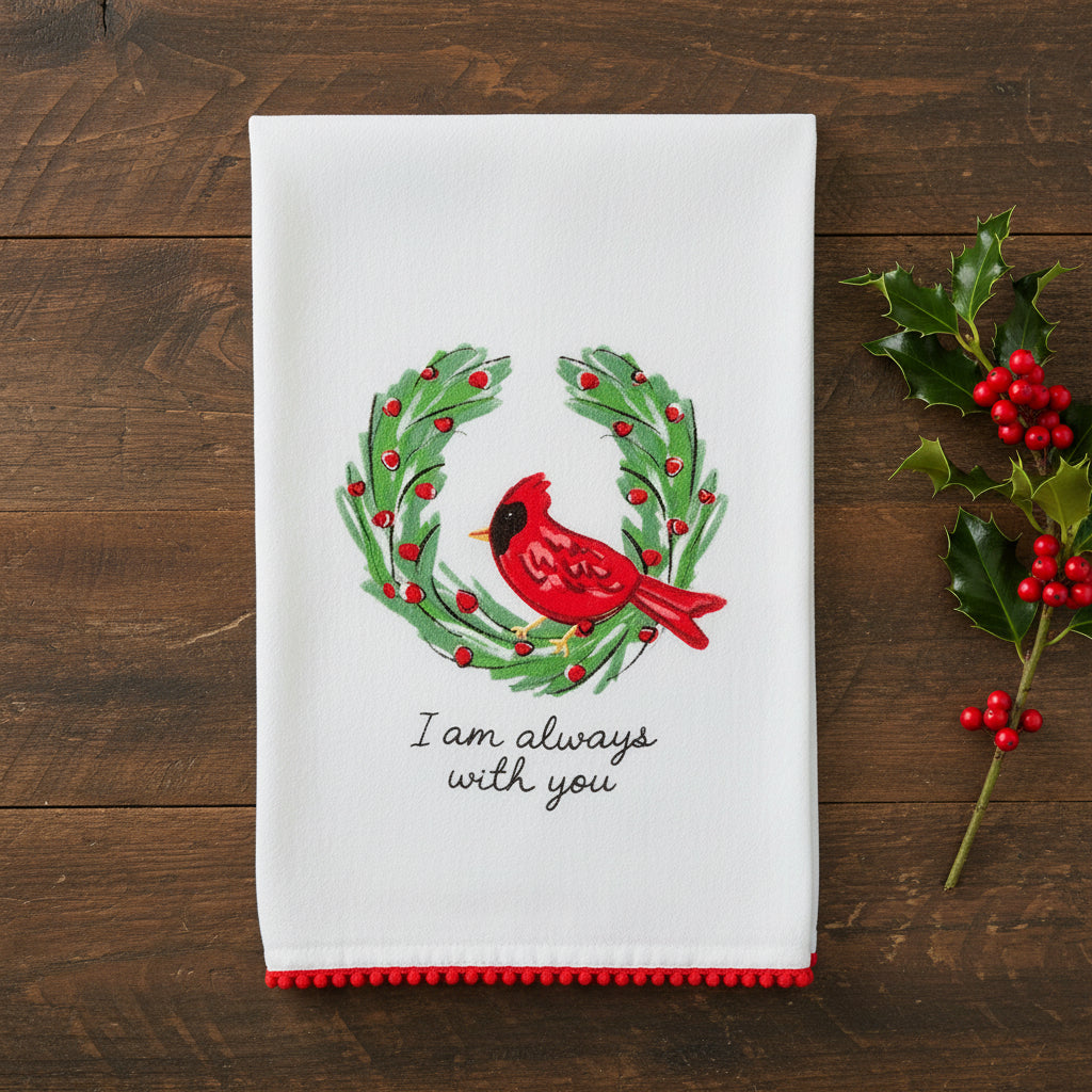 I am always with you cardinal towel on a wood table with greenery