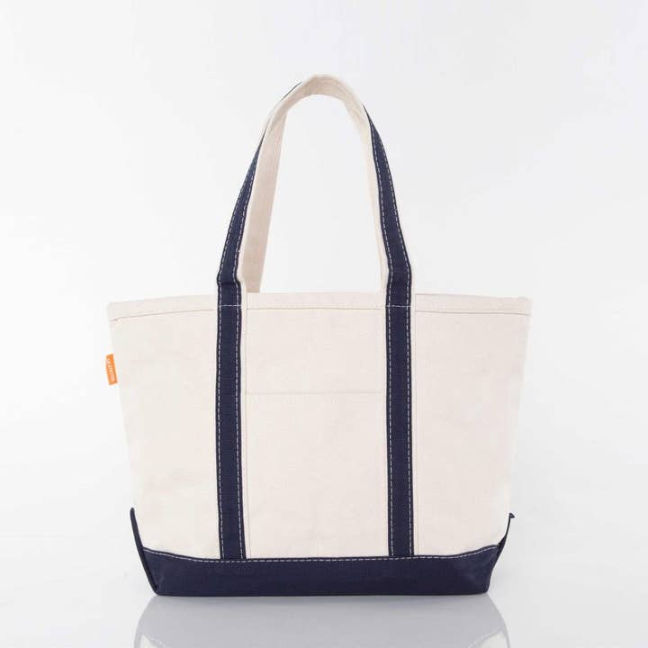 off white tote with navy blue trim and handles