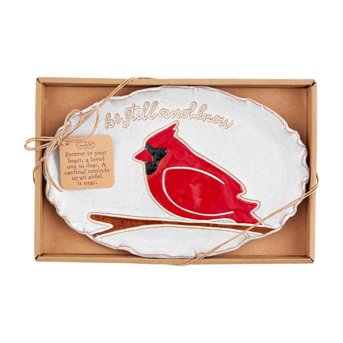 oval cardinal plate with sentiments be still and know displayed in a cardboard tray on a white background