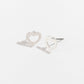 silver heart stud earrings on a white background