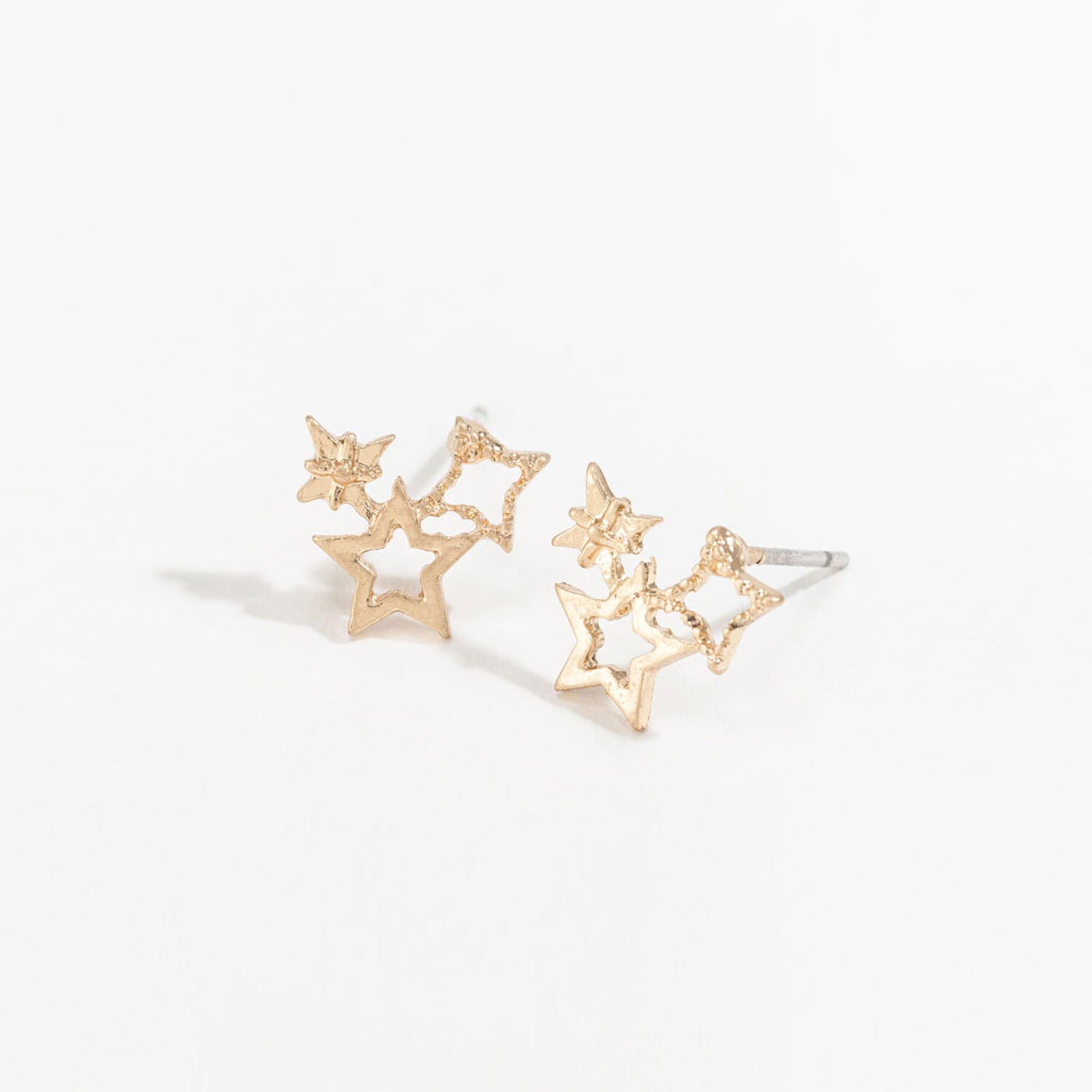 gold star cluster stud earrings on a white background