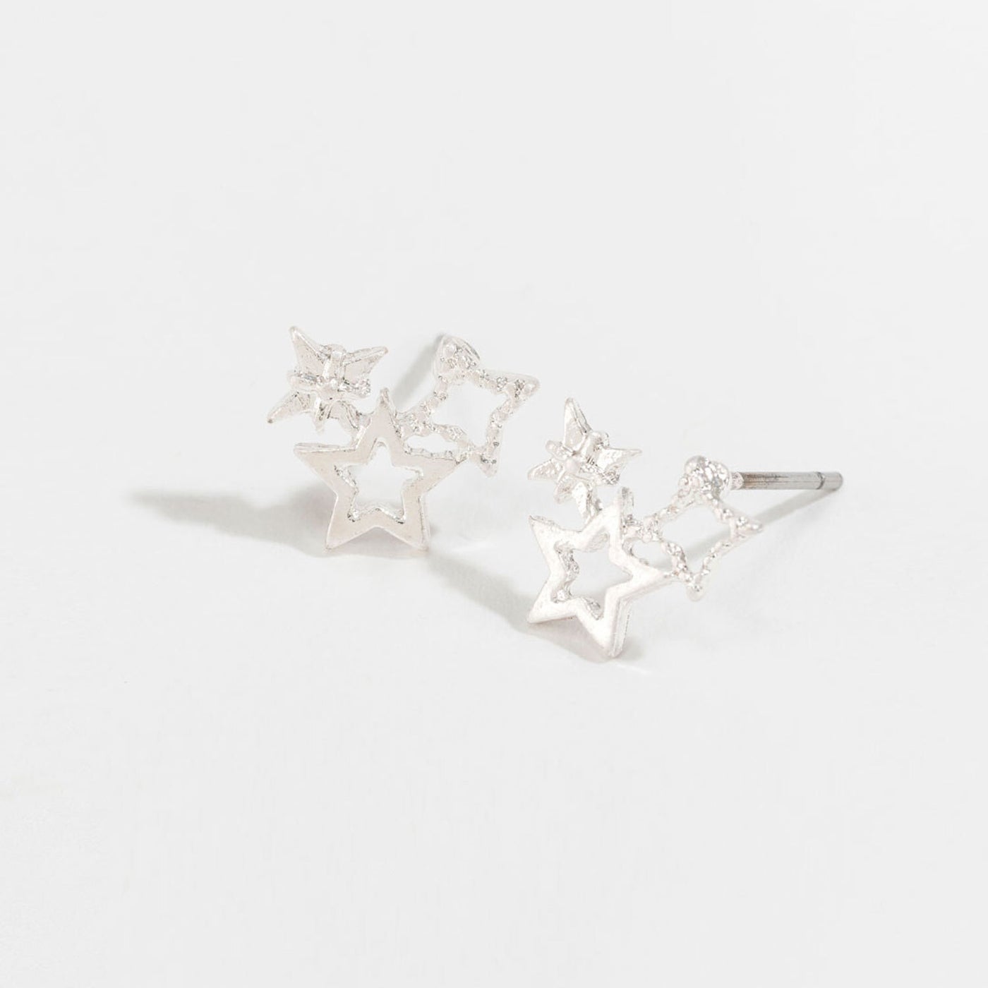 silver star cluster stud earrings on a white background