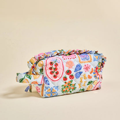 Colorful fabric bag with a pattern on a beige background