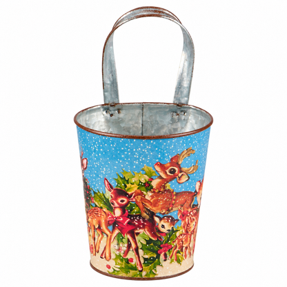 smaller metal bucket with blue background, retro style deer and holly design and a loop handle
