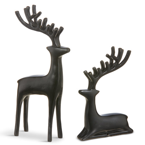 2 black deer figurines arranged on a white background.