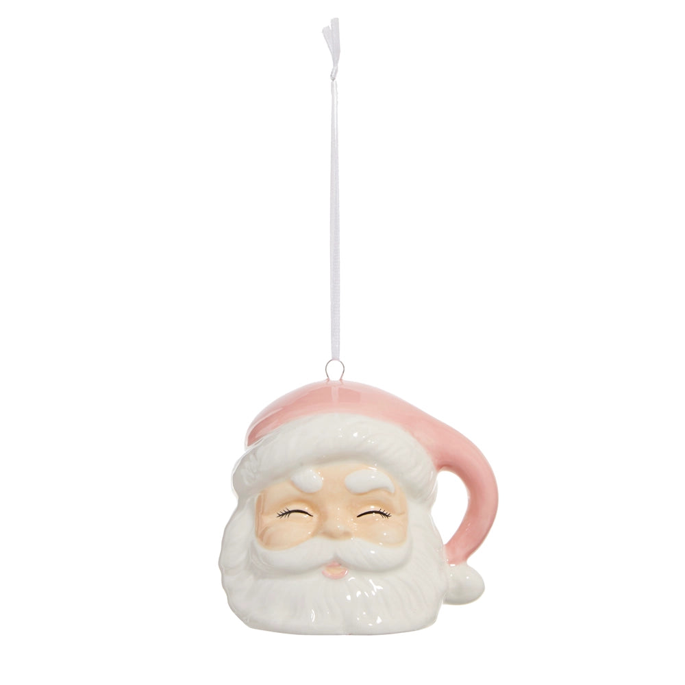 santa head wearing a pink hat ornament against a white background