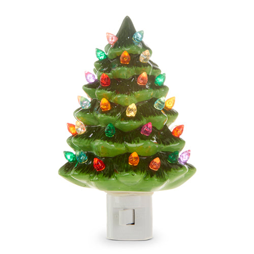 vintage green tree with christmas lights night light against a white background