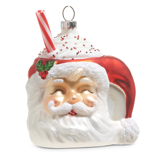 glass ornament shaped like a  santa mug topped with whipped cream and a straw.