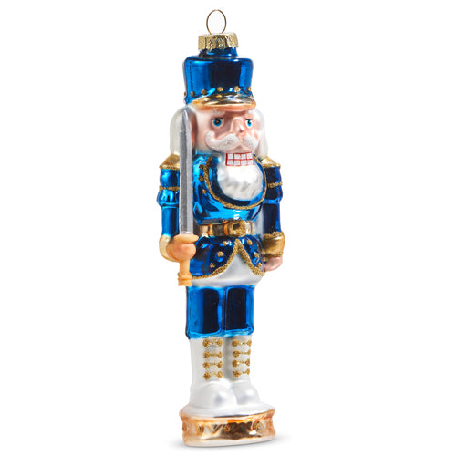 Glass nutcracker ornament Dressed in blue uniform with golden accents.