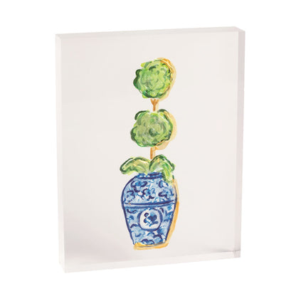 small acrylic block with painted topiary design on it