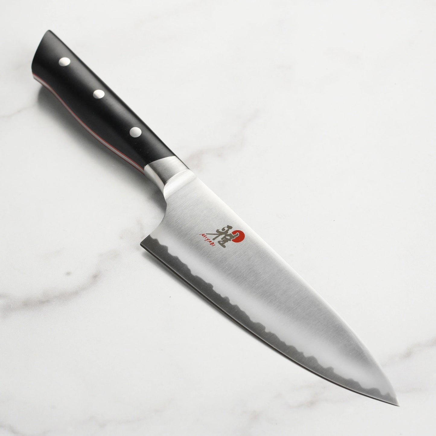 6 inch Chef's Knife set on a white marble surface