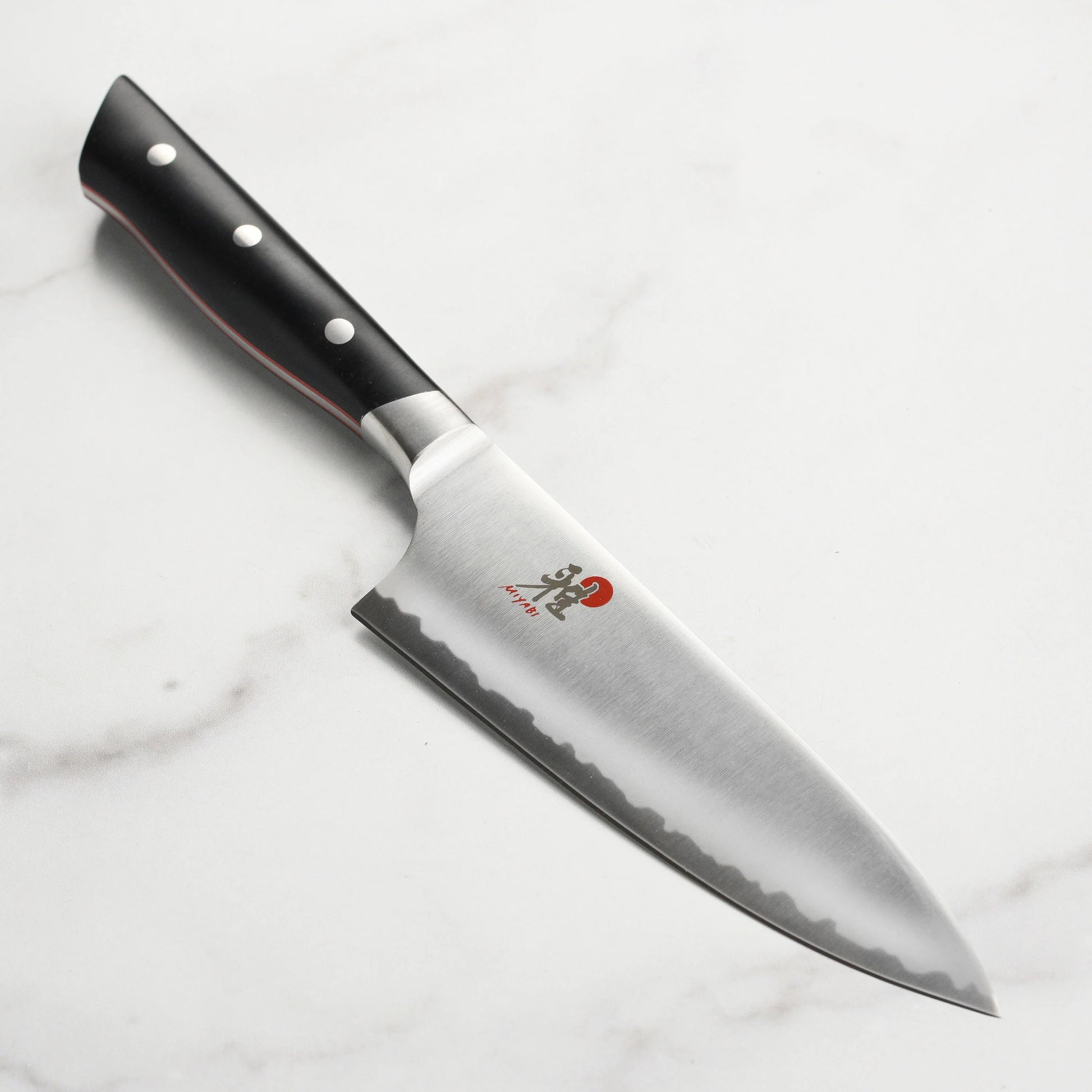 6 inch Chef's Knife set on a white marble surface
