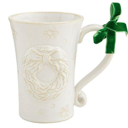 White Christmas Mug with wreath design and green velvet bow tied on the handle.