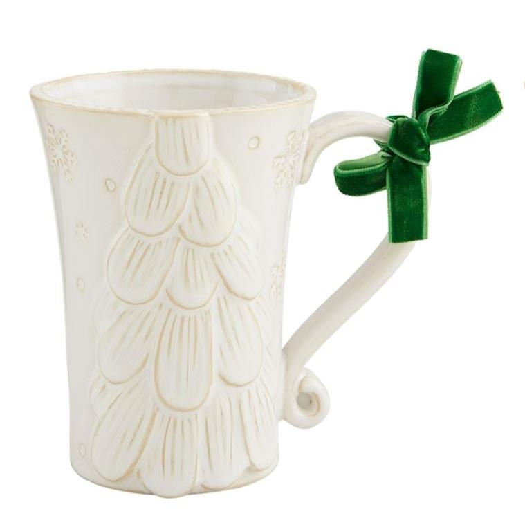 White Christmas Mug with tree design and green velvet bow tied on the handle.