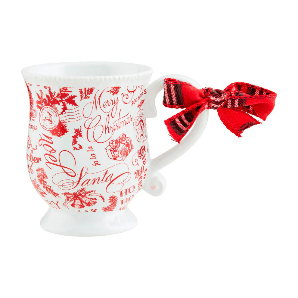 christmas toile mug with "merry christmas" and other holiday sentiments.