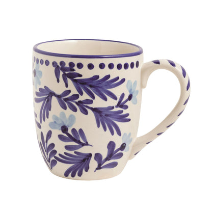 white mug with light and dark blue floral design with dotted rim