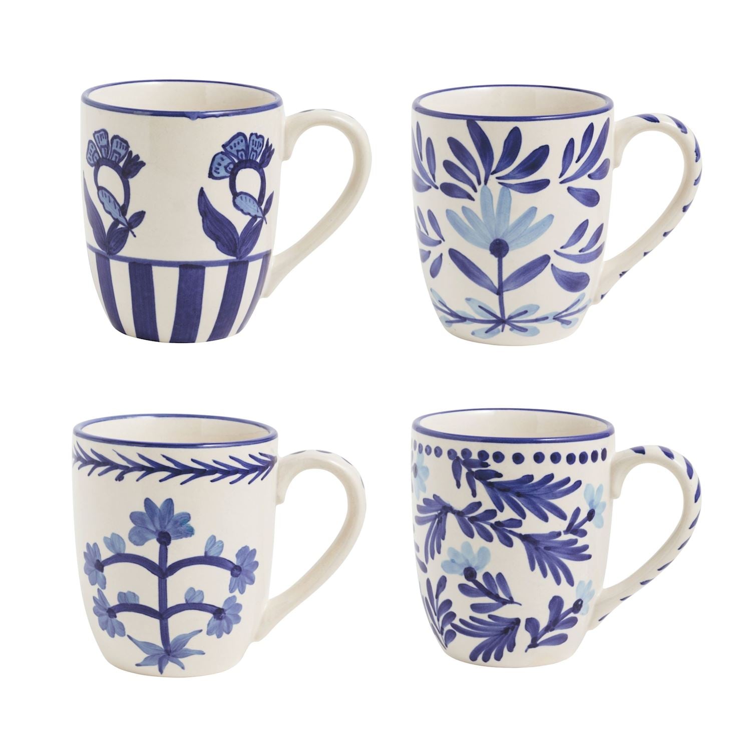 4 assorted blue and white mugs on a white background