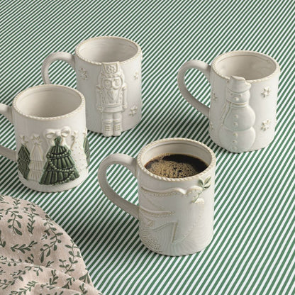 4 mugs on a green and white striped table