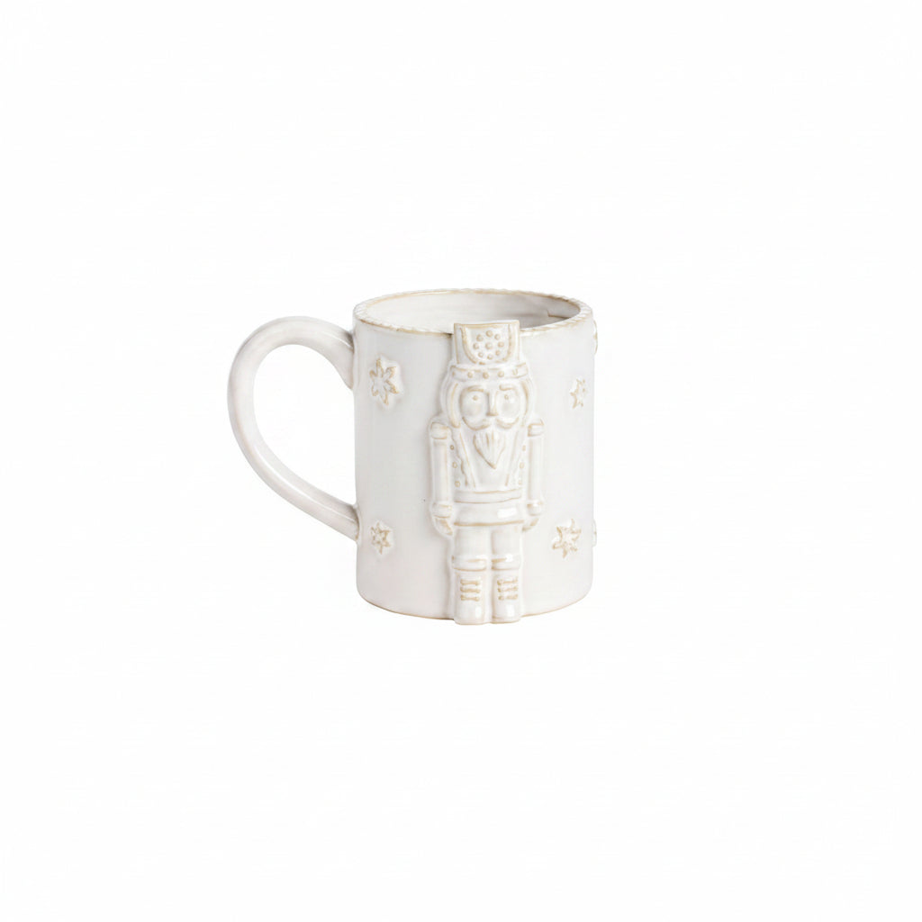 milky white mug with raise nutcracker design also in white
