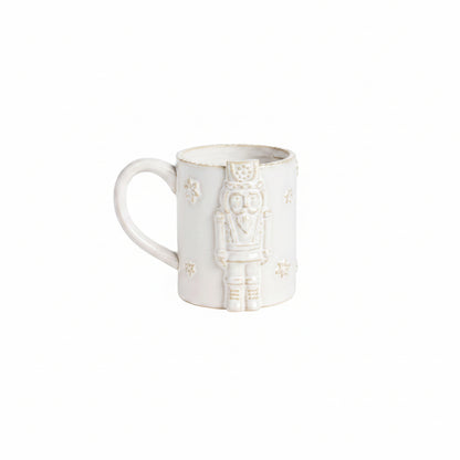 milky white mug with raise nutcracker design also in white