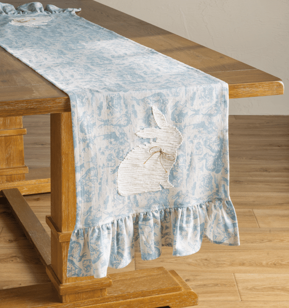 Blue Toile Easter Table Runner draped over the end of a wooden table