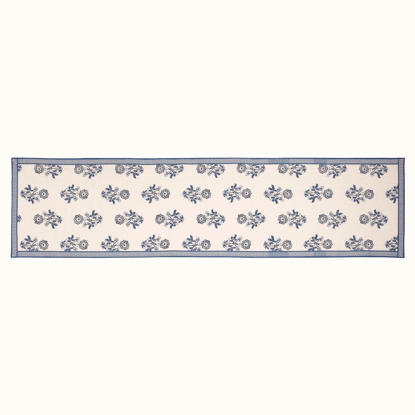 blue and white flower table runner laying flat on a white background