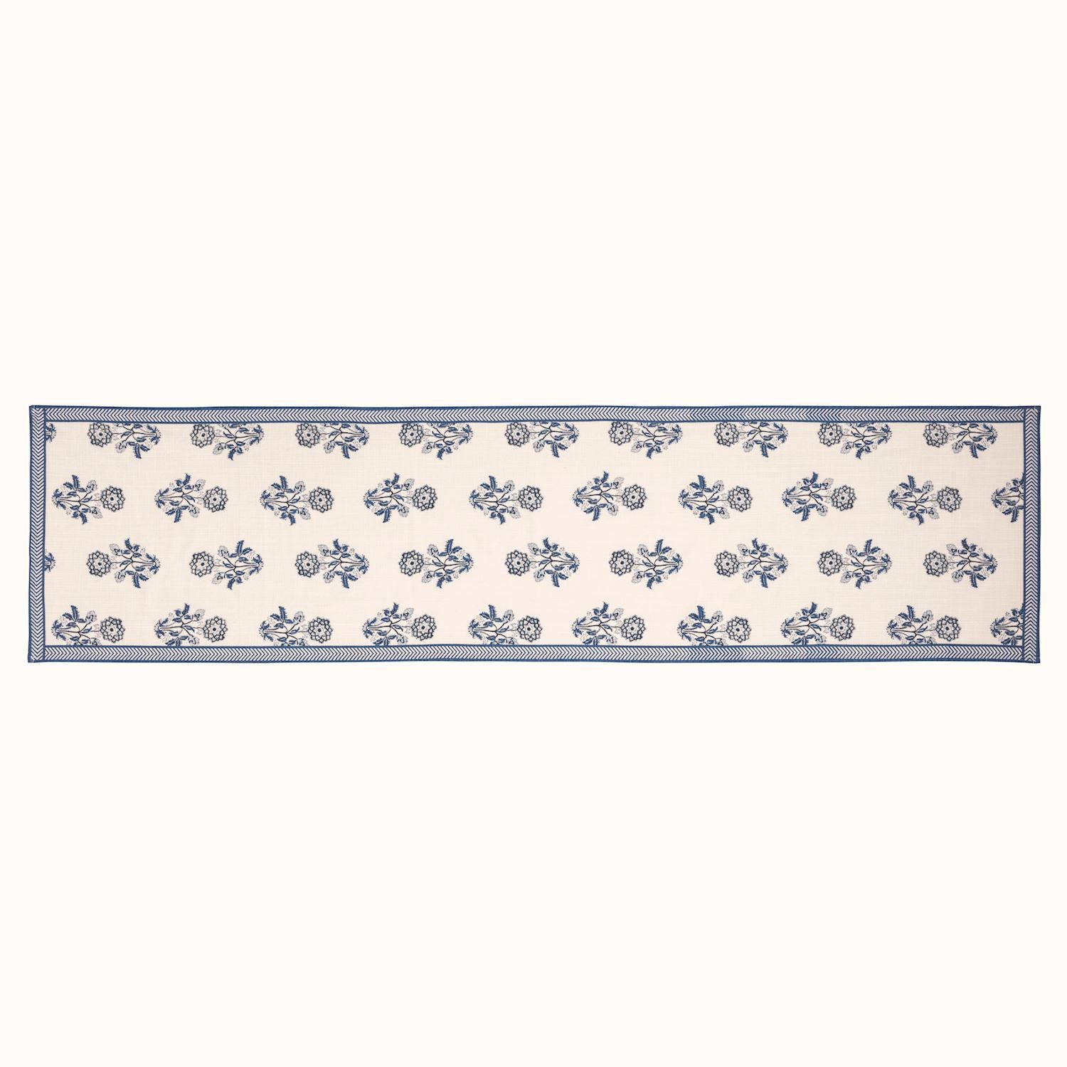 blue and white flower table runner laying flat on a white background