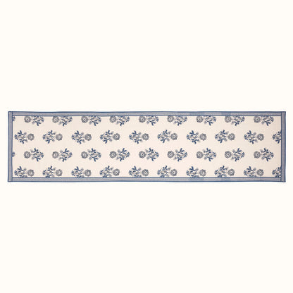 blue and white flower table runner laying flat on a white background