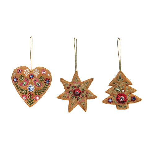 3 styles of embroidered ornaments in a row on a white background.