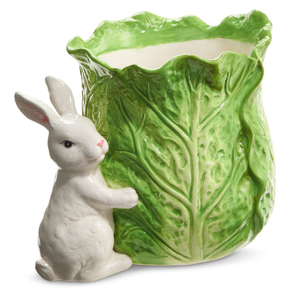 ceramic bunny next to a cabbage shaped vase